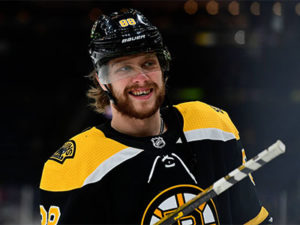 February 25, 2020: Boston Bruins right wing David Pastrnak (88) smiles at fans during the warm up period at the NHL, Eis