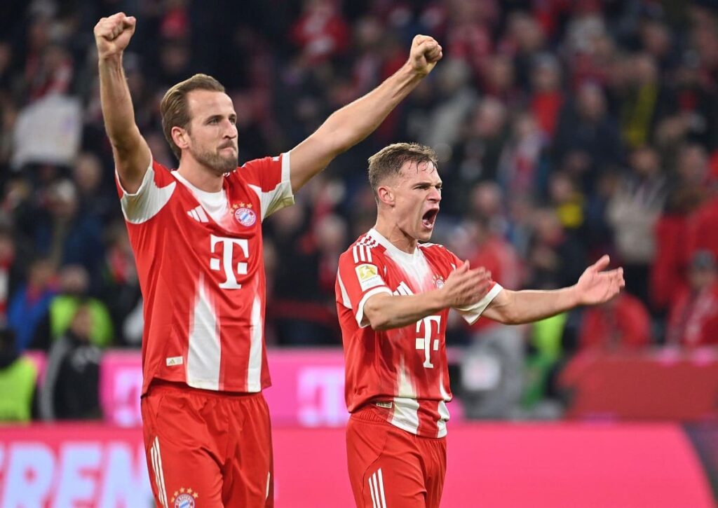 Geht es nach der Champions League KI Prognose zum 3. Spieltag von Supercomputer BETSiE, haben die Bayern (im Bild: Kane und Kimmich) allen Grund, zu jubeln. (© dpa picture alliance / Alamy Stock Photo) Champions League KI Prognose zum 3. Spieltag